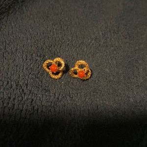 Gold earrings with red stone